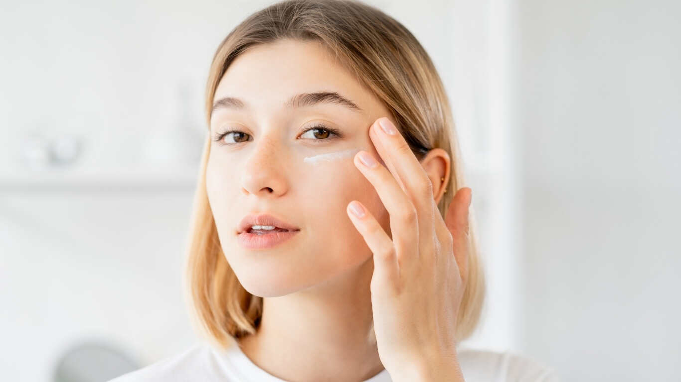 Smiling woman showing luminous results after using Derm Lite cream for face glow daily